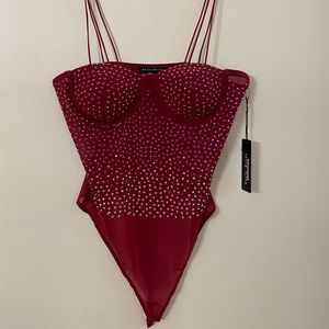 Brand new bedazzled body suit never worn!